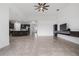This open floorplan shows the kitchen and living room with tiled floors at 2417 Annacella Ave, Kissimmee, FL 34741