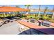 Outdoor kitchen and grilling area equipped with picnic tables overlooking the lake at 2417 Annacella Ave, Kissimmee, FL 34741