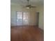 Bright living room with beautiful hardwood floors and french doors leading to the outside at 2603 E Lake Hartridge Dr, Winter Haven, FL 33881