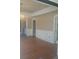 Spacious living room featuring hardwood floors and classic details like decorative wallpaper and trim at 2603 E Lake Hartridge Dr, Winter Haven, FL 33881