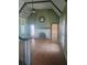 Living room with a fireplace, hardwood floors, and multiple windows at 2603 E Lake Hartridge Dr, Winter Haven, FL 33881