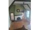 Bright living room featuring a cozy fireplace and hardwood floors at 2603 E Lake Hartridge Dr, Winter Haven, FL 33881