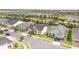 Street view showing neighborhood homes with lush landscaping, driveways, and attached garages at 2604 Meadowedge Loop, St Cloud, FL 34772