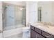 Bathroom features a tiled shower, granite countertops and a vanity at 2604 Meadowedge Loop, St Cloud, FL 34772