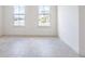 Bright bedroom with tiled flooring and natural light from the large windows at 2604 Meadowedge Loop, St Cloud, FL 34772
