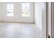 Bright bedroom with tiled flooring and natural light from the large windows at 2604 Meadowedge Loop, St Cloud, FL 34772