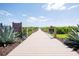 Scenic boardwalk leading to the Twin Lakes Dock at Live Oak Lake at 2604 Meadowedge Loop, St Cloud, FL 34772
