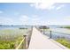 Dock at Live Oak Lake featuring a gazebo, boat lift, and kayak launch at 2604 Meadowedge Loop, St Cloud, FL 34772