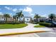 Welcoming entrance to Emerson Plaza featuring lush landscaping, palm trees, and inviting architecture at 2604 Meadowedge Loop, St Cloud, FL 34772