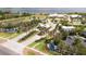 Aerial view showcasing a grand entrance with manicured landscaping and a welcoming fountain at 2604 Meadowedge Loop, St Cloud, FL 34772