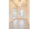 Bright entryway with tile flooring, decorative chandelier, and white trim at 2604 Meadowedge Loop, St Cloud, FL 34772