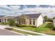 Attractive single-Gathering home with a manicured lawn, tidy landscaping and a grey roof at 2604 Meadowedge Loop, St Cloud, FL 34772
