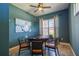 Community game room with poker table, chairs, and natural light at 2604 Meadowedge Loop, St Cloud, FL 34772