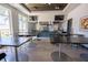 Bright kitchen features stainless steel appliances, tile backsplash, and spacious countertops at 2604 Meadowedge Loop, St Cloud, FL 34772