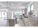Spacious kitchen with granite counters, stainless steel appliances and a view to the patio at 2604 Meadowedge Loop, St Cloud, FL 34772