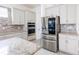 Stylish kitchen featuring modern stainless steel refrigerator and granite countertops at 2604 Meadowedge Loop, St Cloud, FL 34772