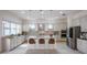 Modern kitchen with a large island, stainless steel appliances, and stylish pendant lighting at 2604 Meadowedge Loop, St Cloud, FL 34772