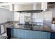 Bright kitchen features stainless steel appliances, modern cabinets, and kitchen island at 2604 Meadowedge Loop, St Cloud, FL 34772