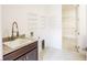 Well-equipped laundry room boasts ample counter space, storage shelves, and a utility sink at 2604 Meadowedge Loop, St Cloud, FL 34772