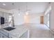 Open-concept floor plan with stainless steel appliances, granite countertops, tile flooring, and ample living space at 2604 Meadowedge Loop, St Cloud, FL 34772