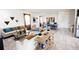 Clubhouse seating area with sofas, chairs, and a ping pong table at 2604 Meadowedge Loop, St Cloud, FL 34772