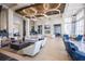 Luxurious lounge area with ample seating, modern lighting, and stylish décor at 2604 Meadowedge Loop, St Cloud, FL 34772