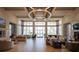 Spacious lounge featuring high ceilings, modern lighting, and stylish seating arrangements at 2604 Meadowedge Loop, St Cloud, FL 34772