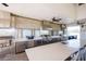 Outdoor kitchen with grill, sink, stainless steel appliances, and quartz countertops at 2604 Meadowedge Loop, St Cloud, FL 34772