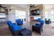 Outdoor living space with ceiling fans, a stone fireplace, stainless grill, and comfortable seating at 2604 Meadowedge Loop, St Cloud, FL 34772