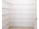 Walk-in pantry featuring wire shelving for organized food storage and easy access at 2604 Meadowedge Loop, St Cloud, FL 34772