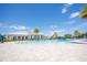 Resort-style zero-entry community pool with palm trees and expansive sun deck at 2604 Meadowedge Loop, St Cloud, FL 34772