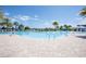 Large community pool featuring sun deck, lounge chairs, and splash pad at 2604 Meadowedge Loop, St Cloud, FL 34772