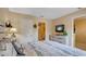 Bedroom with carpet floors, dresser, and ensuite bathroom at 2605 Daulby St, Kissimmee, FL 34747