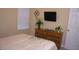 Bedroom featuring carpet floors, light walls, and a dresser at 2605 Daulby St, Kissimmee, FL 34747