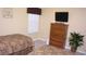 This bedroom features two beds, a dresser, and a window at 2605 Daulby St, Kissimmee, FL 34747