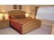 Cozy bedroom features a large bed, nightstands with lamps, and a window for natural light at 2605 Daulby St, Kissimmee, FL 34747