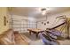 Bright game room featuring a pool table, basketball game, and comfortable leather sofa at 2605 Daulby St, Kissimmee, FL 34747