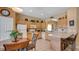 Well-equipped kitchen with wooden cabinets, breakfast bar, and tiled floors at 2605 Daulby St, Kissimmee, FL 34747