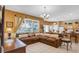 Open concept living room and kitchen with tile flooring and an abundance of natural light at 2605 Daulby St, Kissimmee, FL 34747