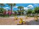 Community playground features rocking horses and a castle play structure with lush green landscaping at 2605 Daulby St, Kissimmee, FL 34747