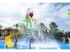 A fun community splash pad and playground, with water features and slide, perfect for a hot day at 2605 Daulby St, Kissimmee, FL 34747