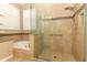 Bathroom with glass-enclosed shower, separate tub, granite countertop and mosaic tile at 2752 Bellewater Pl, Oviedo, FL 32765