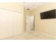 Bedroom featuring carpet floors, a closet and a mounted TV at 2752 Bellewater Pl, Oviedo, FL 32765