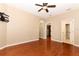 Spacious bedroom with hardwood floors, ceiling fan, walk-in closet and ensuite bathroom at 2752 Bellewater Pl, Oviedo, FL 32765