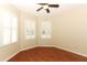 Bright bedroom with hardwood floors, ceiling fan and two sunny windows with shutters at 2752 Bellewater Pl, Oviedo, FL 32765