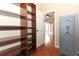 Spacious walk-in closet with custom shelving and a gun safe for added security at 2752 Bellewater Pl, Oviedo, FL 32765