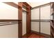 Well-organized walk-in closet featuring custom shelving and rod system for optimal storage at 2752 Bellewater Pl, Oviedo, FL 32765