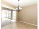 Elegant dining area with a chandelier and sliding glass doors to the patio at 2752 Bellewater Pl, Oviedo, FL 32765