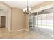 Open dining area with a chandelier and sliding glass doors that lead to a screened patio at 2752 Bellewater Pl, Oviedo, FL 32765