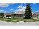 Corner lot features a well-maintained lawn and partial view of the home's exterior at 2752 Bellewater Pl, Oviedo, FL 32765